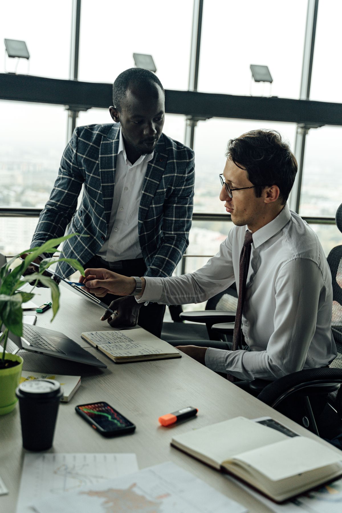Business professionals discussing a project in an office